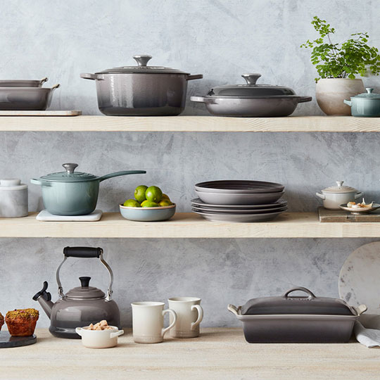 oyster gray and light sea salt blue shades of cookware on shelves