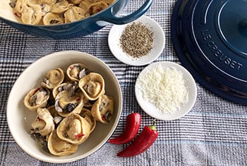 mushroom pasta in a striking agave blue dutch oven