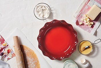 red pie dish with ruffled edges
