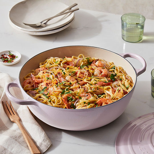 shrimp pasta in a pink dutch oven
