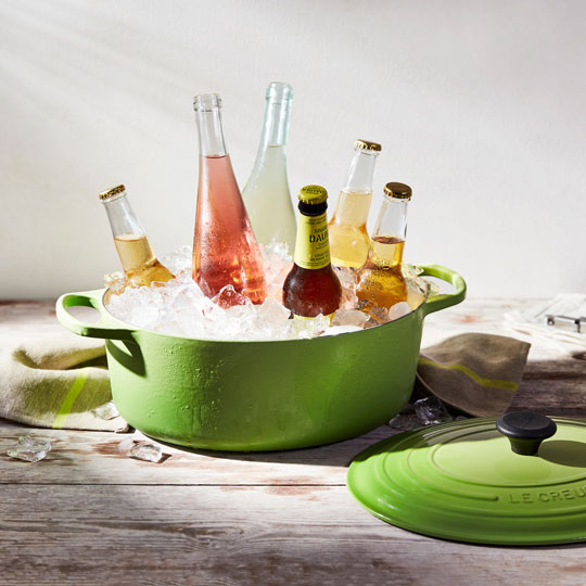dutch oven filled with ice and bottles of beer and soda