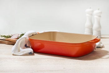 cast iron roaster in flame orange