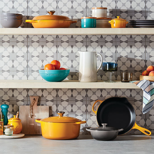 assorted yellow and turquoise items on shelves