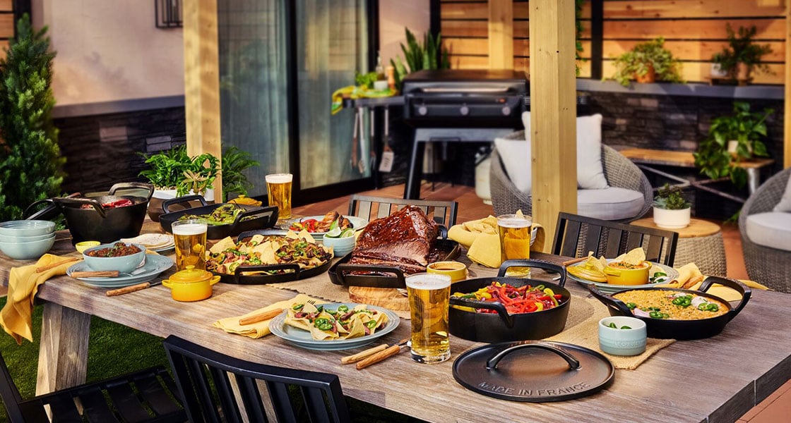 alpine collection cookware filled with food on an outdoor table