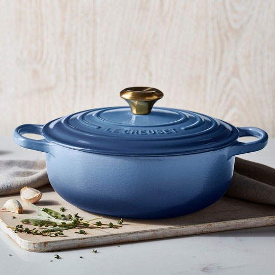 chambray light blue shallow dutch oven with herbs