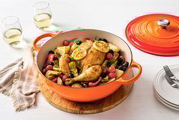 roast chicken in an orange chef's oven