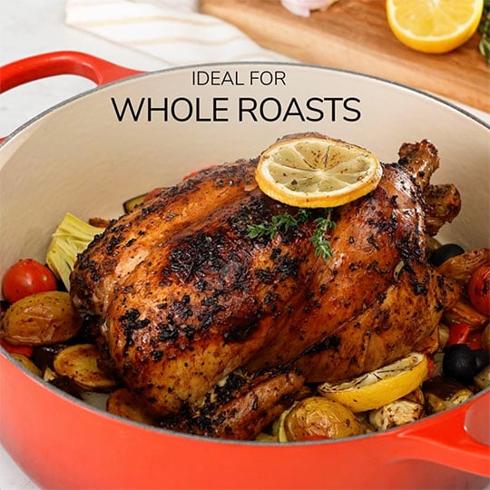 wide dutch oven used to roast a whole chicken overlaid with text that reads: ideal for whole roasts