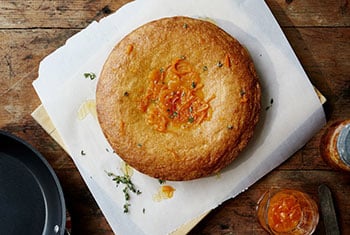 golden cake with shreds of orange peel on top