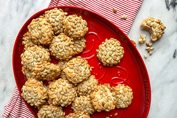 pine nut cookies on a santa shaped platter