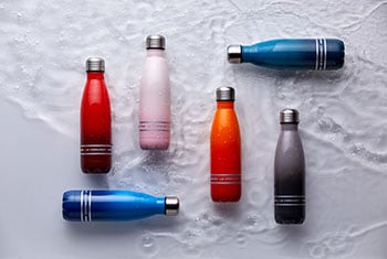 stainless steel water bottle in various bright hues