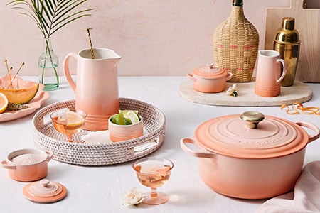 assorted peche items surrounded by peach surfaces and accessories