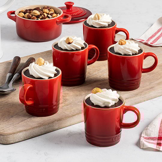 whipped cream-topped desserts in espresso mugs