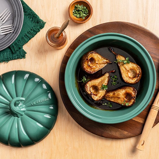 pears roasted in a pumpkin shaped baker