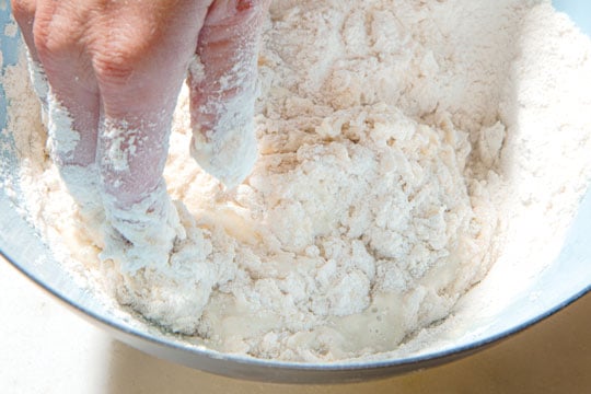 mixing flour with liquid by hand