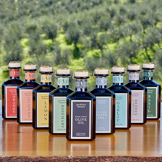 an array of olive oil botttles in different flavors and varieties from McEvoy Ranch
