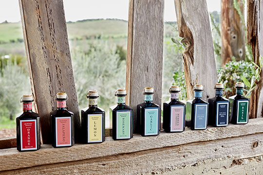 an array of colorful olive oil bottles from McEvoy Ranch