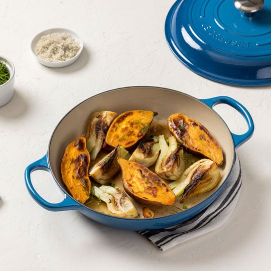 blue braiser with quartered squash and fennel