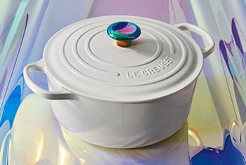 white dutch oven with an iridescent knob