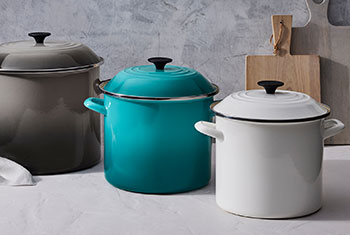 gray, turquoise and white stockpots of varying size