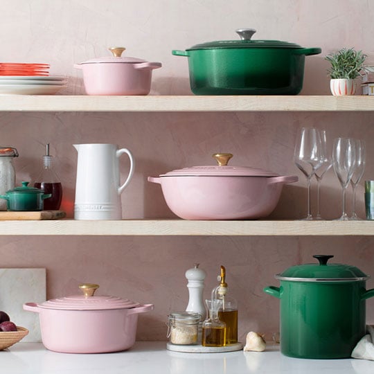 pink and vibrant green cookware on a shelf