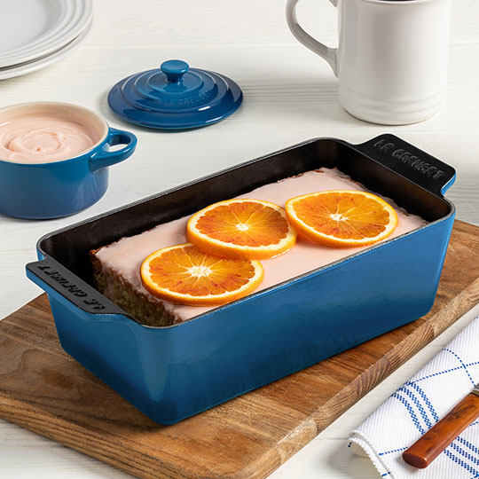 cake topped with orange slices in a loaf pan