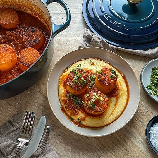 large radishes coated in red sauce