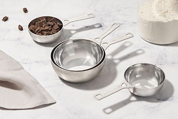 assorted measuring cups with baking ingredients
