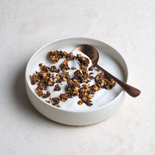 golden brown granola in yogurt