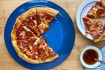 pepperoni pizza on a blue pizza stone - links to recipe