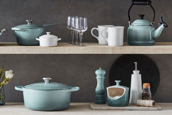 light blue green cookware on shelves
