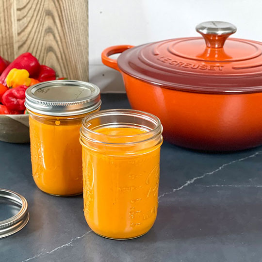 jarred sauce next to a dutch oven