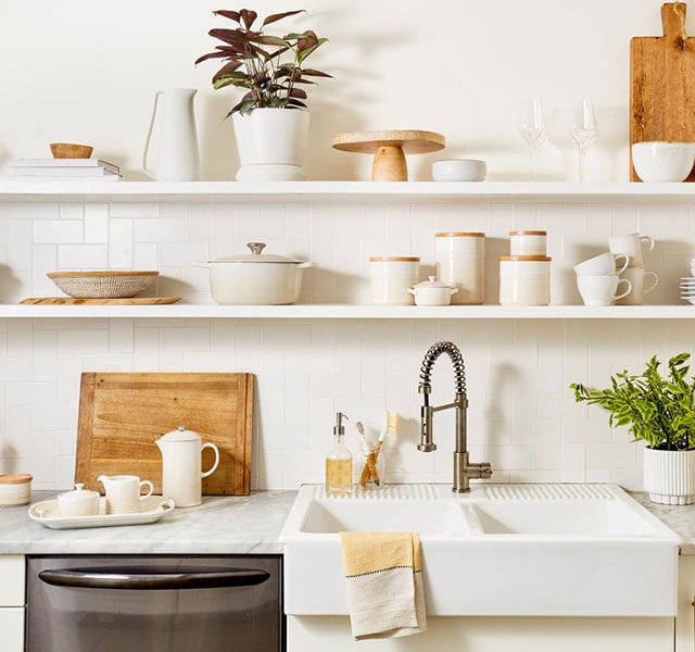 cream colored cookware on shelves