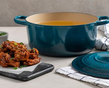 dutch oven filled with oil for frying chicken