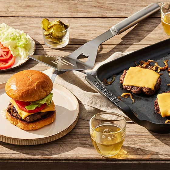 burgers cooked on a grill