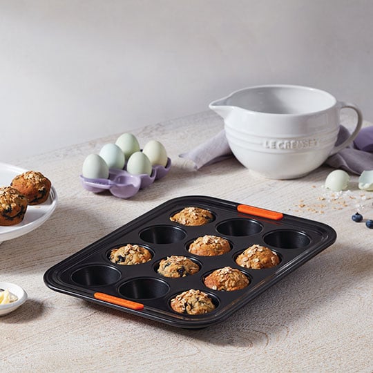blueberry muffins in a non-stick muffin pan