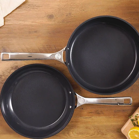 smaller and larger non-stick fry pans side by side