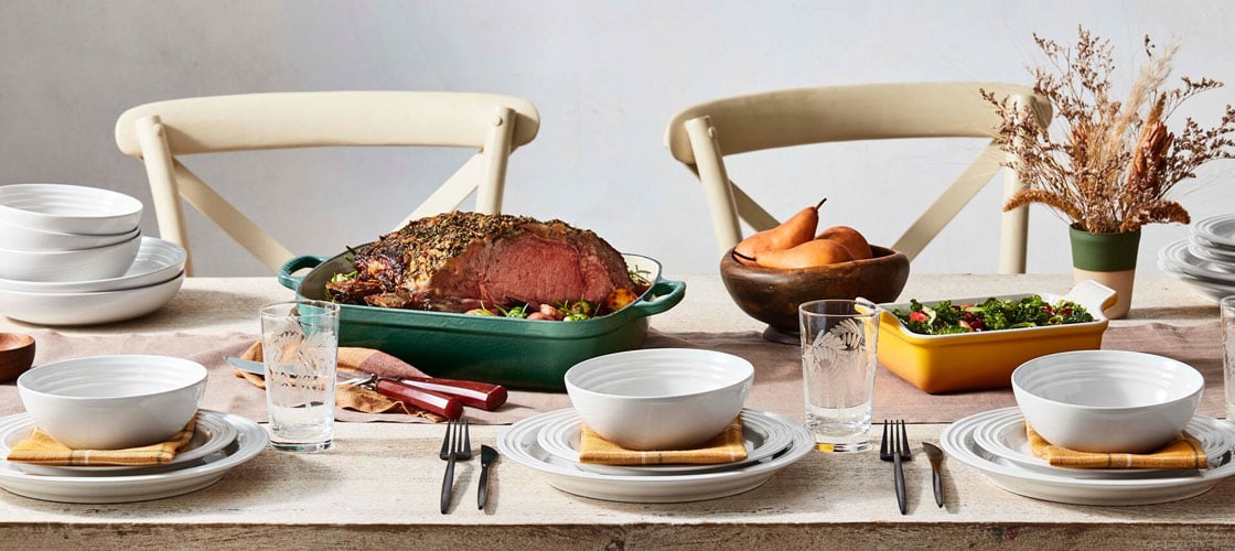 tablescape featuring white, yellow and green cookware and tableware