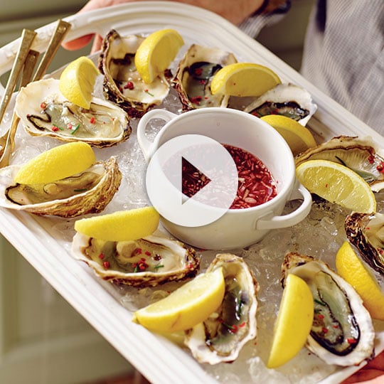 oysters topped with lemon wedges