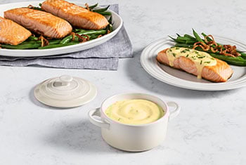 salmon served with a creamy yellow sauce