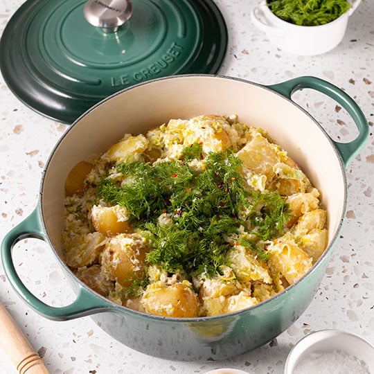potato salad topped with herbs
