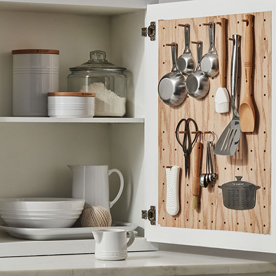 utensils hanging on a peg board