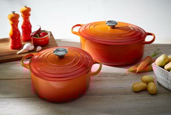 round and oval dutch oven in flame orange