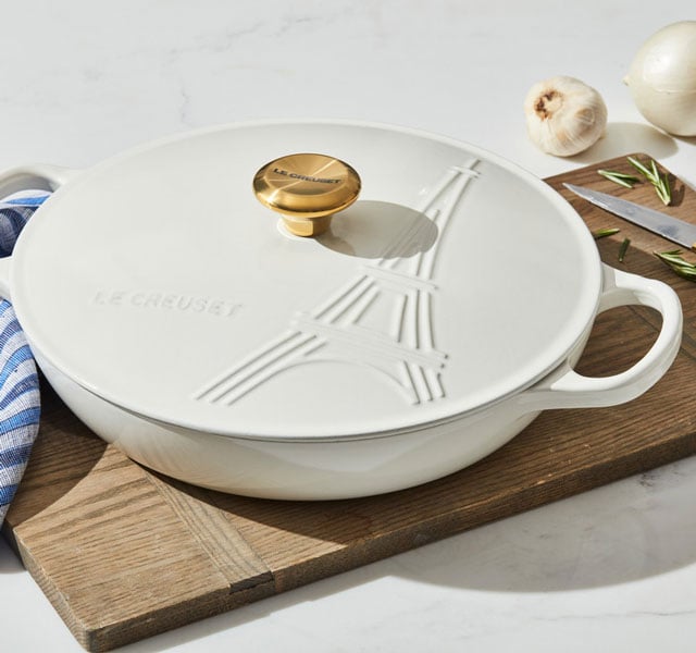 cast iron soup pot in white with eiffel tower embossed on the lid