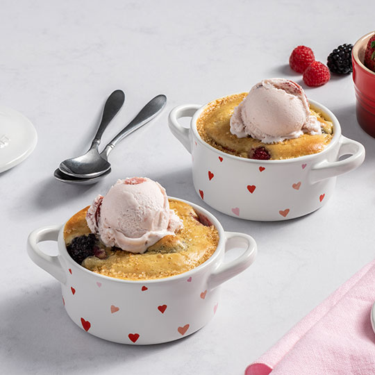 berry cobblers in white mini cocottes with a printed heart pattern