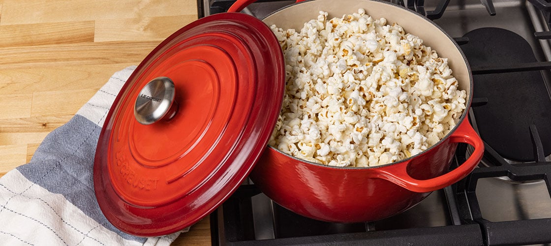 popcorn in a red dutch oven