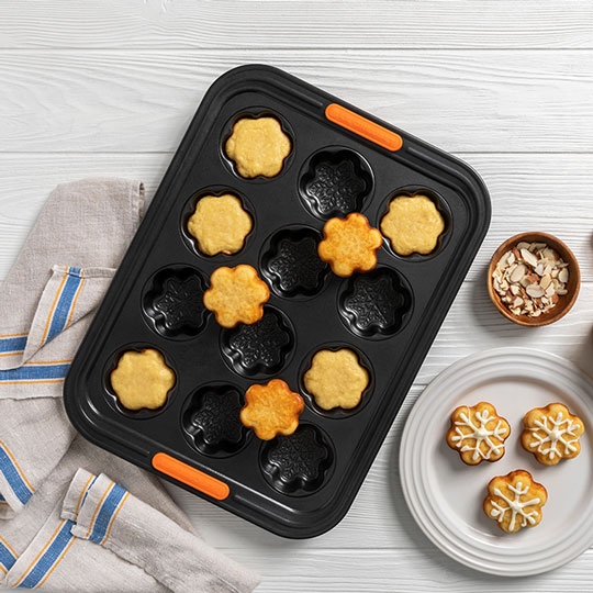 mini snowflake shaped cakes in a non-stick novelty baking pan