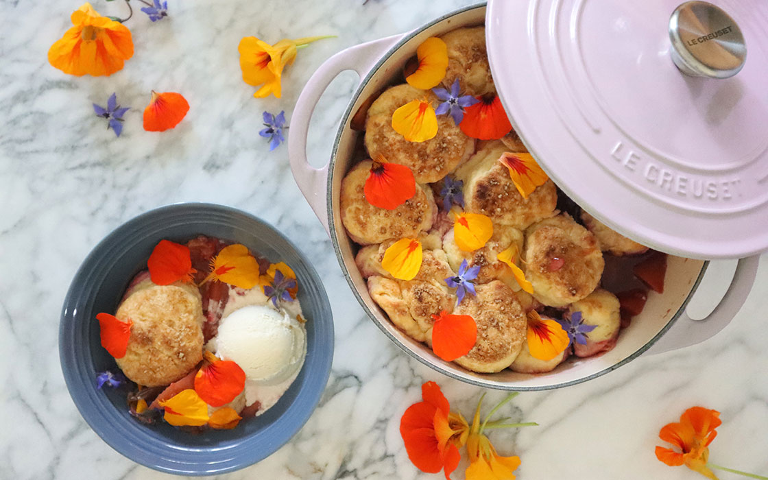 peach cobbler covered with flower petals