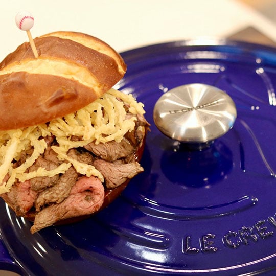 steak sandwish topped with fried onions