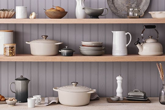 white and brioche cookware on shelves