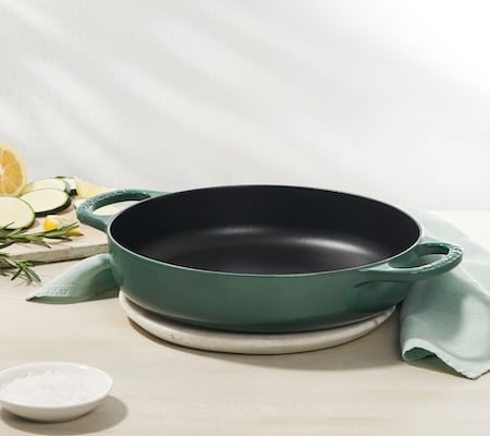 round cast iron piece with black satin enamel on the interior